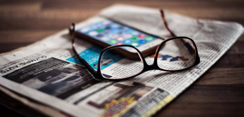 close-up-eyeglasses-mobile-phone-newspaper-table (1)